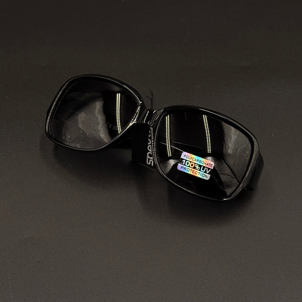 Amara Black frame with blue smoky lenses and gold crystal temple