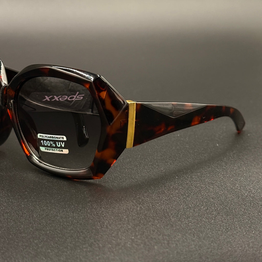 Sabrina tortoise frame with blue smoky lenses and gold hinge detail